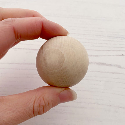 40mm wooden bead in hand